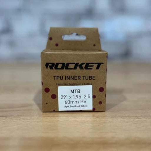 Cardboard box with 'Rocket' branding on a wooden surface