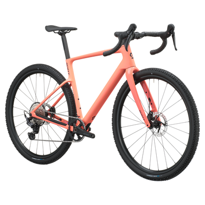 A coral pink gravel bicycle with black components, including the tires, saddle, handlebars, and wheels, shown on a solid white background.